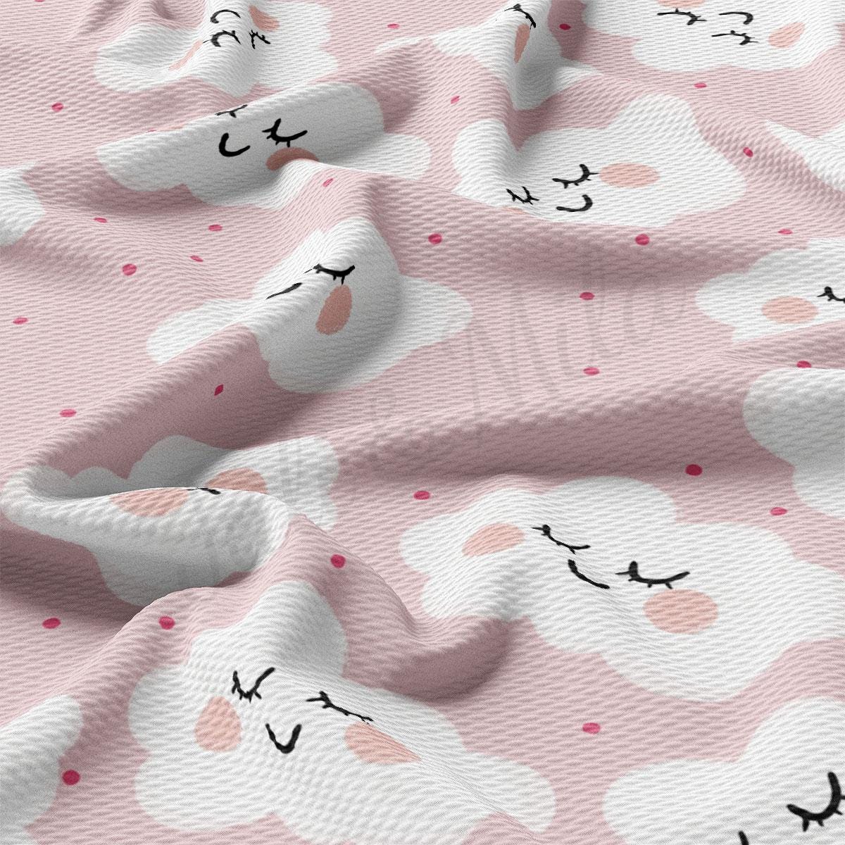 a close up of a pink and white fabric