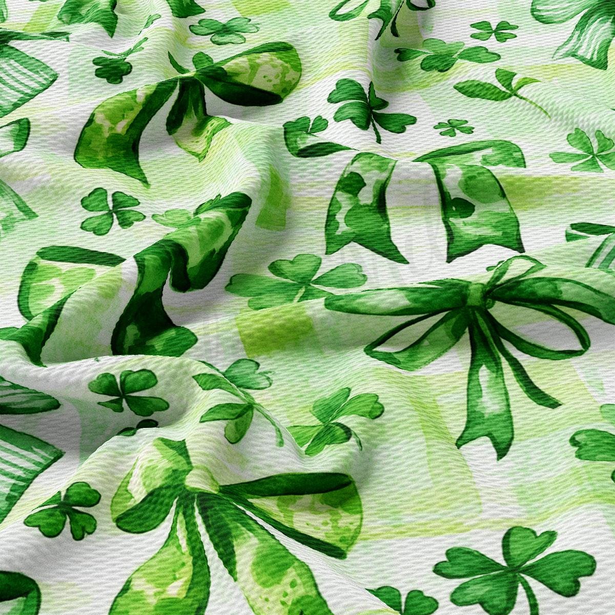 a green and white fabric with shamrocks on it