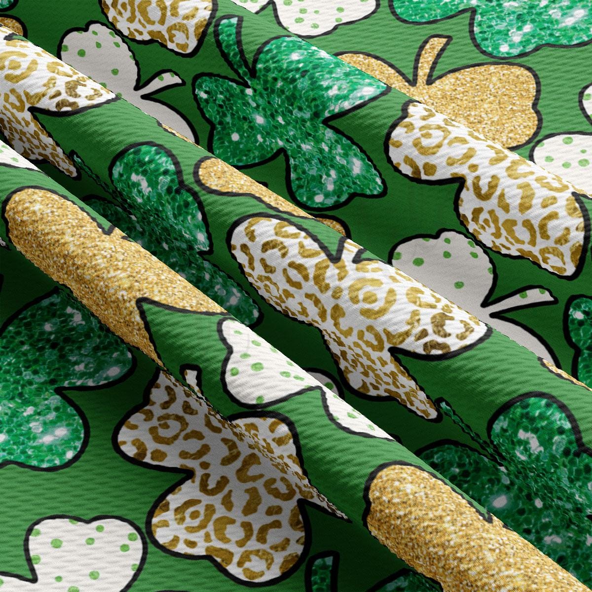 a close up of a green and gold patterned fabric