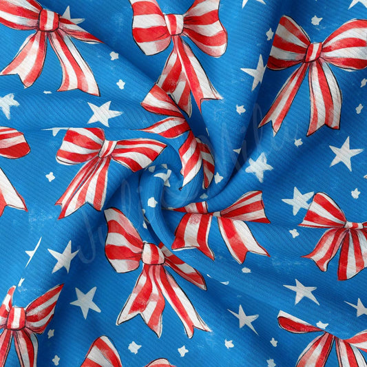 a blue background with red, white and blue bows
