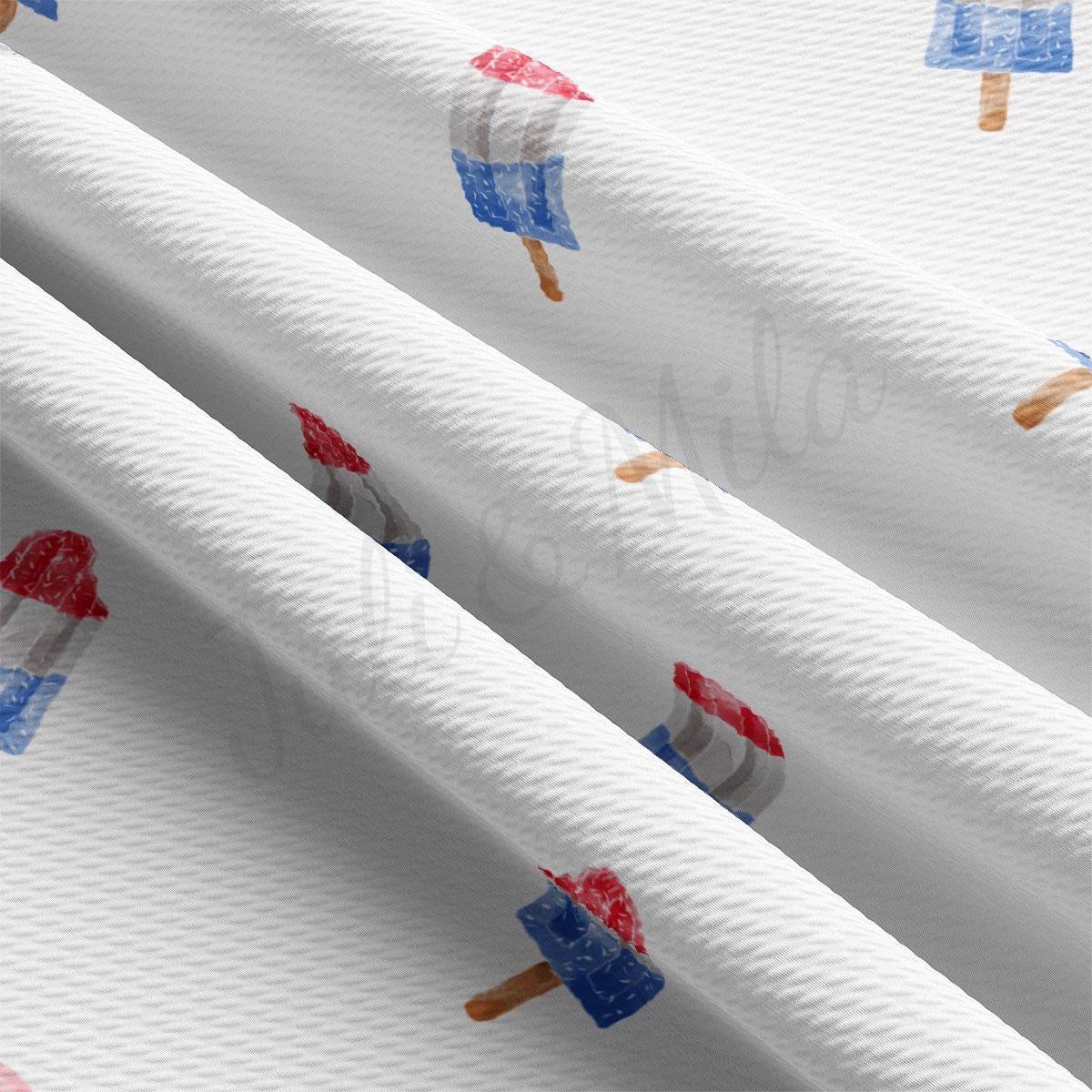 a close up of a white curtain with red, white, and blue ice cream