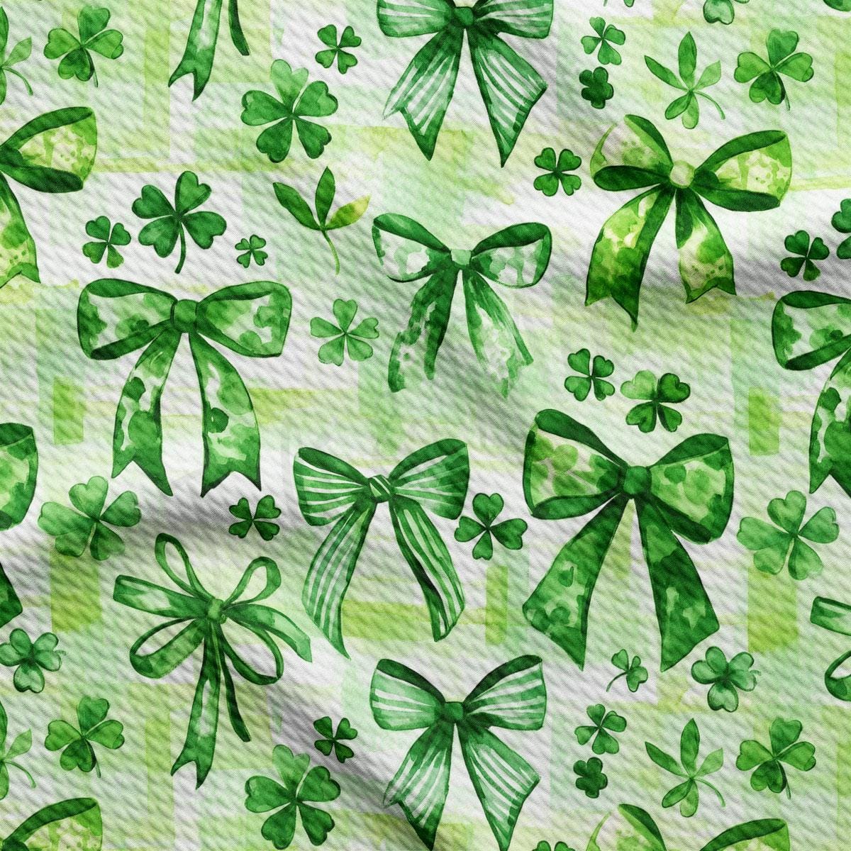 a pattern of green bows and shamrocks
