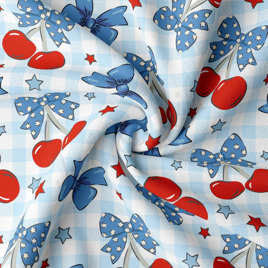 a blue and white checkered fabric with red, white, and blue cherries