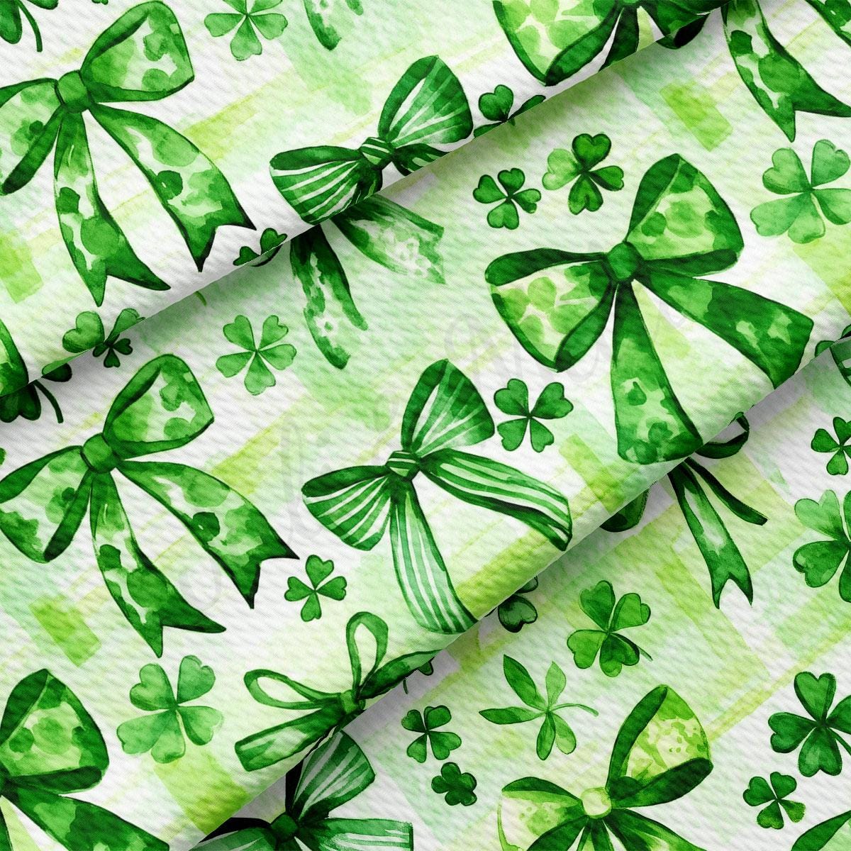 a green and white background with shamrocks on it