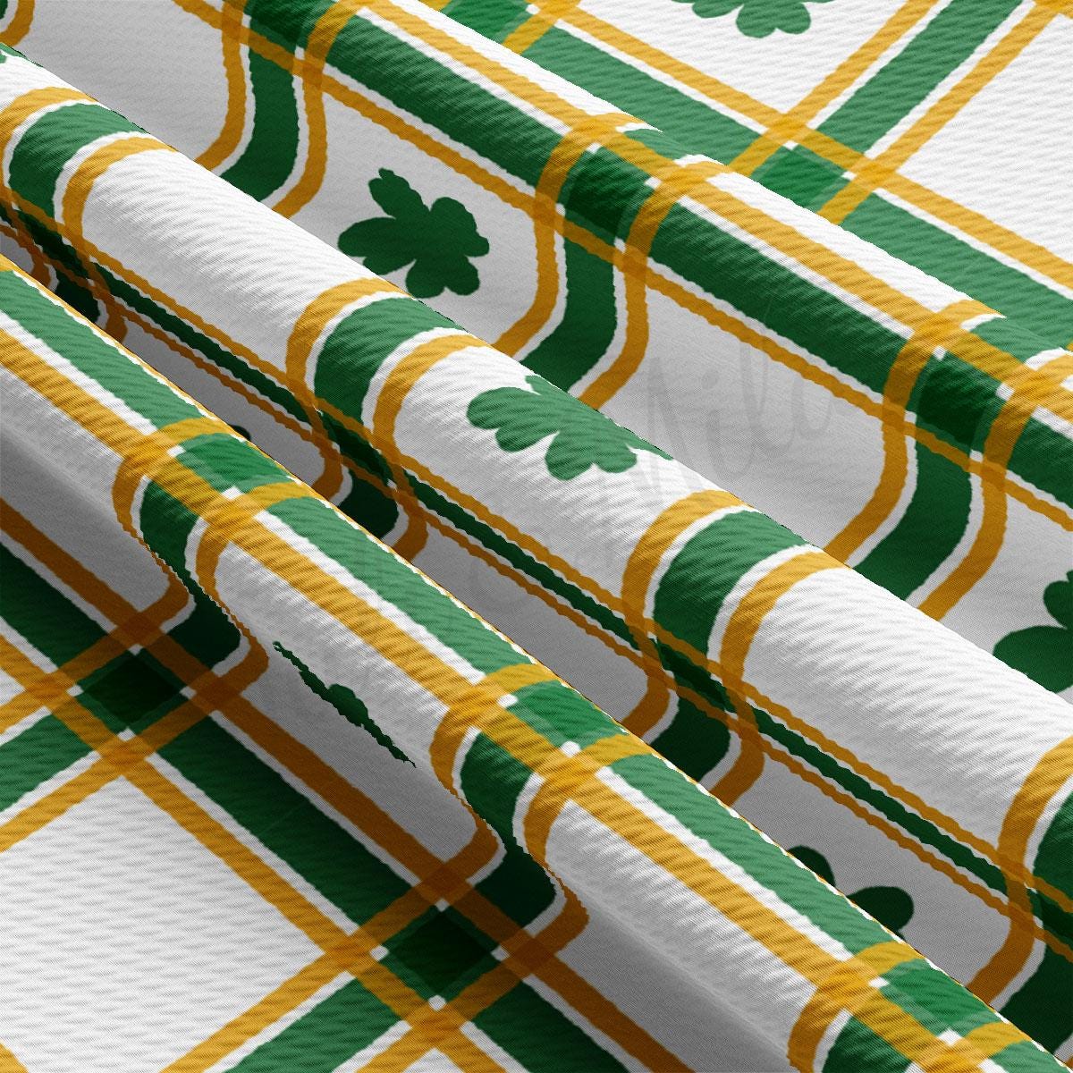 a green and yellow plaid with shamrocks on it
