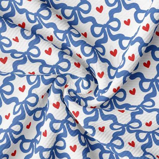 a white and blue fabric with red hearts on it