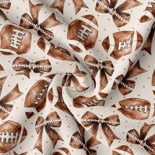 a repeating pattern of brown footballs with white stitching and white polka dots on a white background.