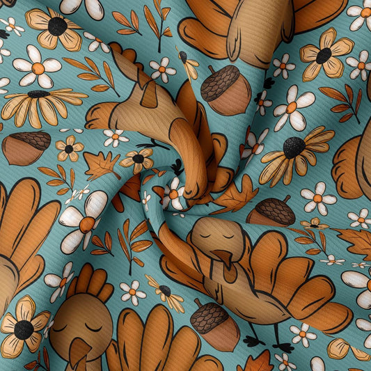 The image is a close-up of a fabric with a repeating pattern of autumn-themed elements, including flowers, leaves, acorns, and turkeys.