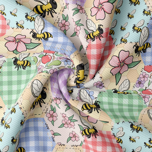 a multicolored checkered fabric with bees and flowers