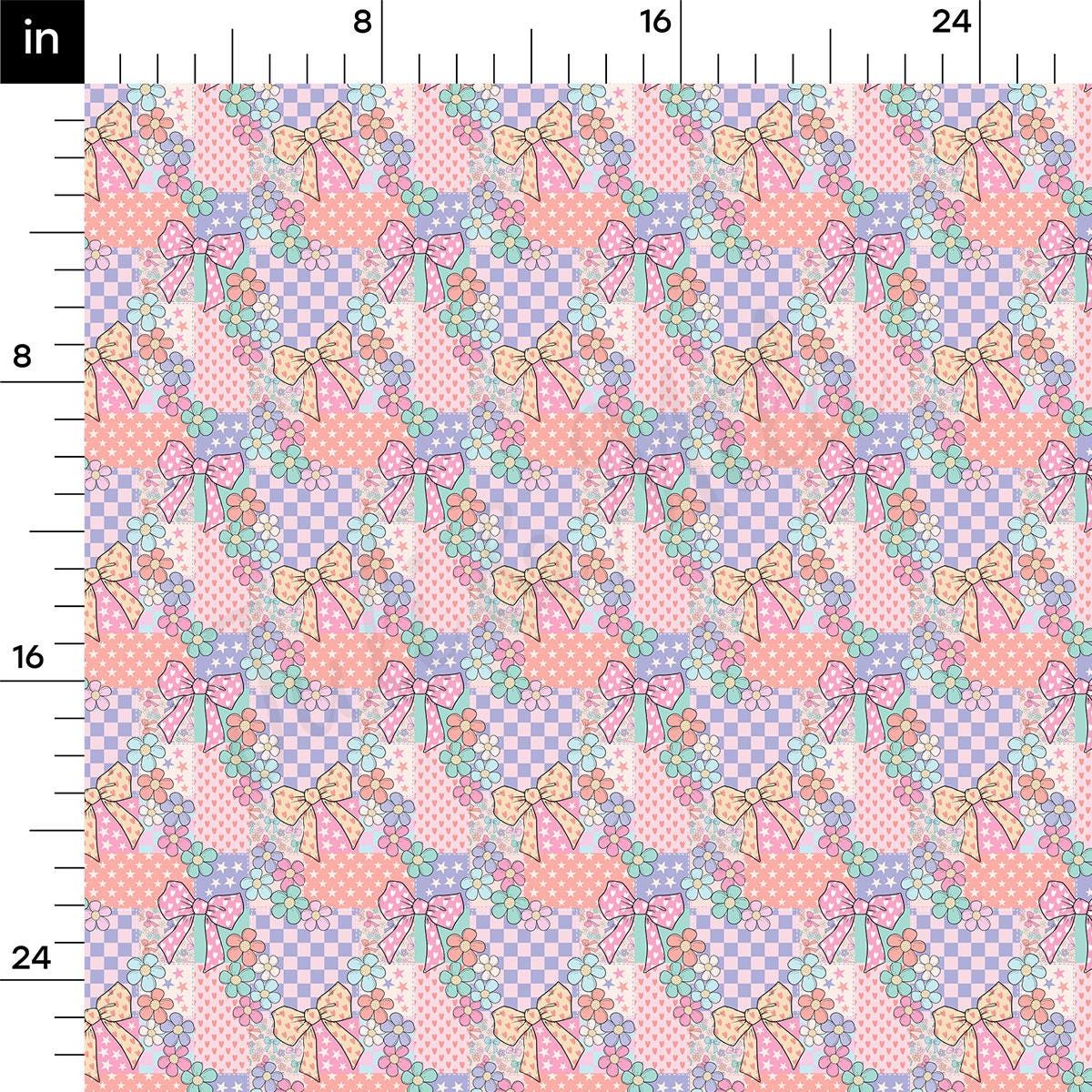 a pink and blue quilt with bows on it