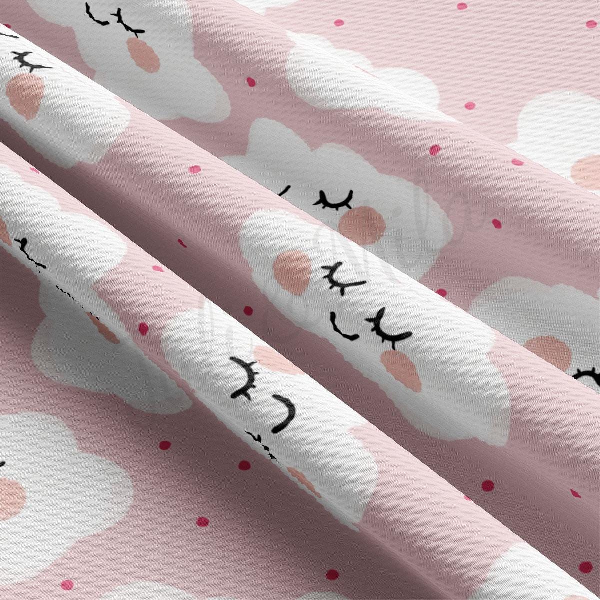 a close up of a pink background with clouds and cats