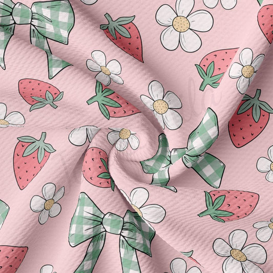 a pink background with a pattern of strawberries and flowers