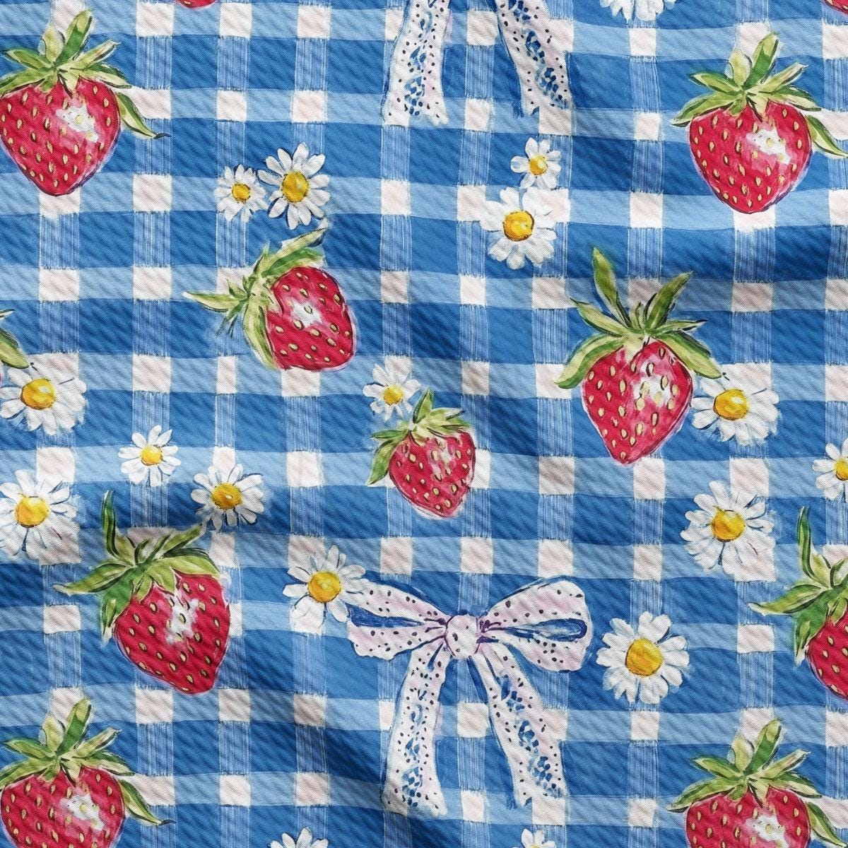 a blue and white checkered fabric with strawberries and daisies