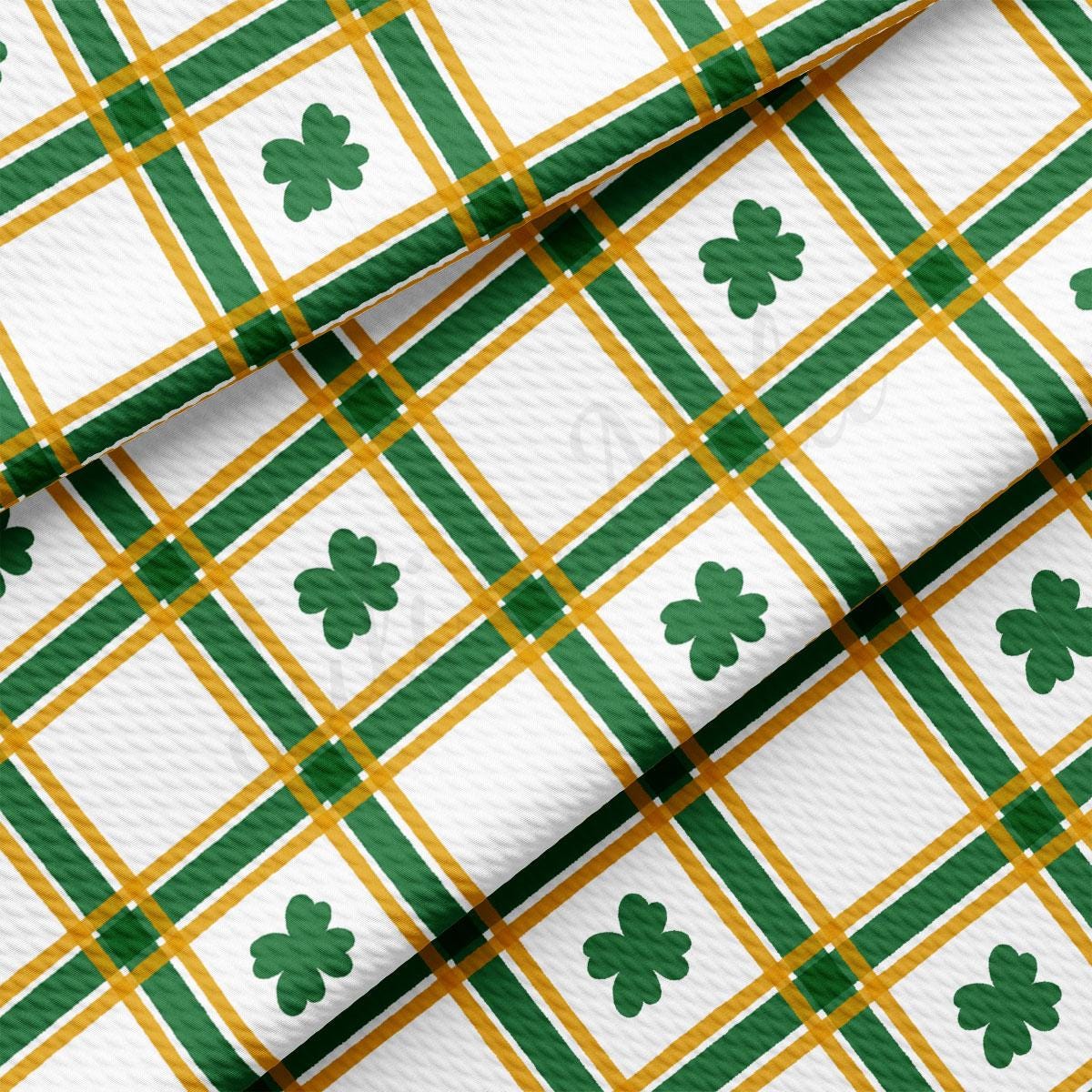 a green and white plaid with shamrocks on it