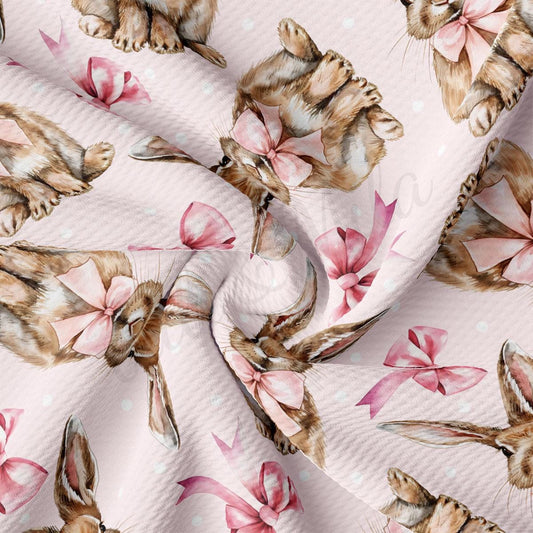 a cat with a bow on a pink background