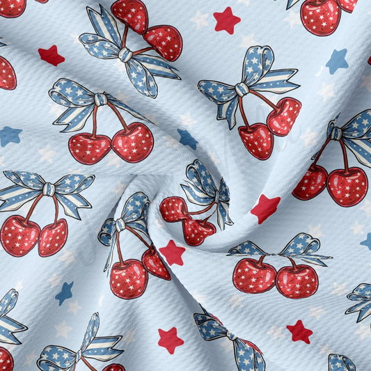 a fabric with cherries and stars on it