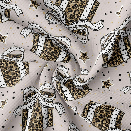 a repeating pattern of leopard print gift boxes with white polka dots and gold stars on a light gray background.