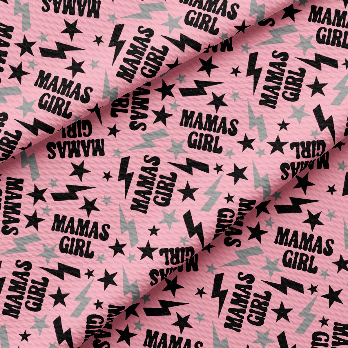 a pink background with black stars and the words mama's girl