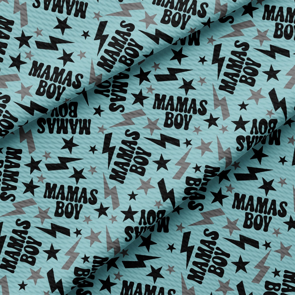 a blue background with black stars and the words mama's boy on it