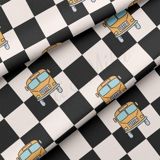 a black and white checkered pattern with a yellow truck on it