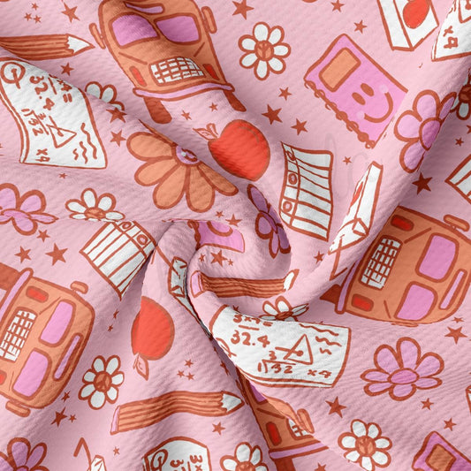 a pink fabric with a pattern of different things on it