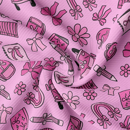 a pink fabric with pink and black designs on it