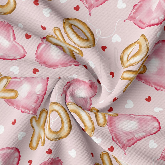 a close up of a pink fabric with hearts on it