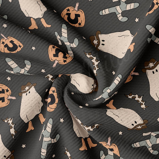 a fabric with a pattern of snowmen and pumpkins
