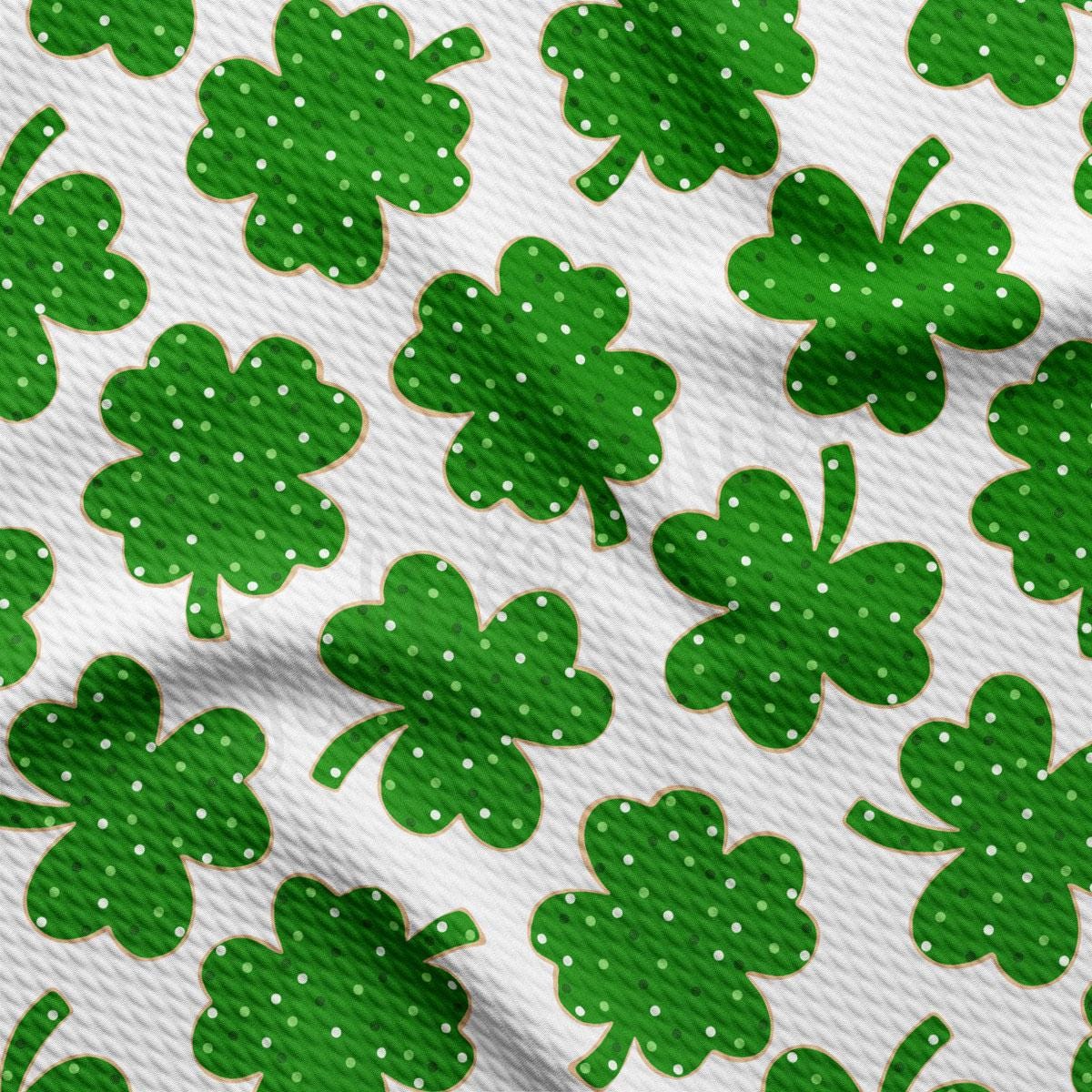 a pattern of green shamrocks on a white background
