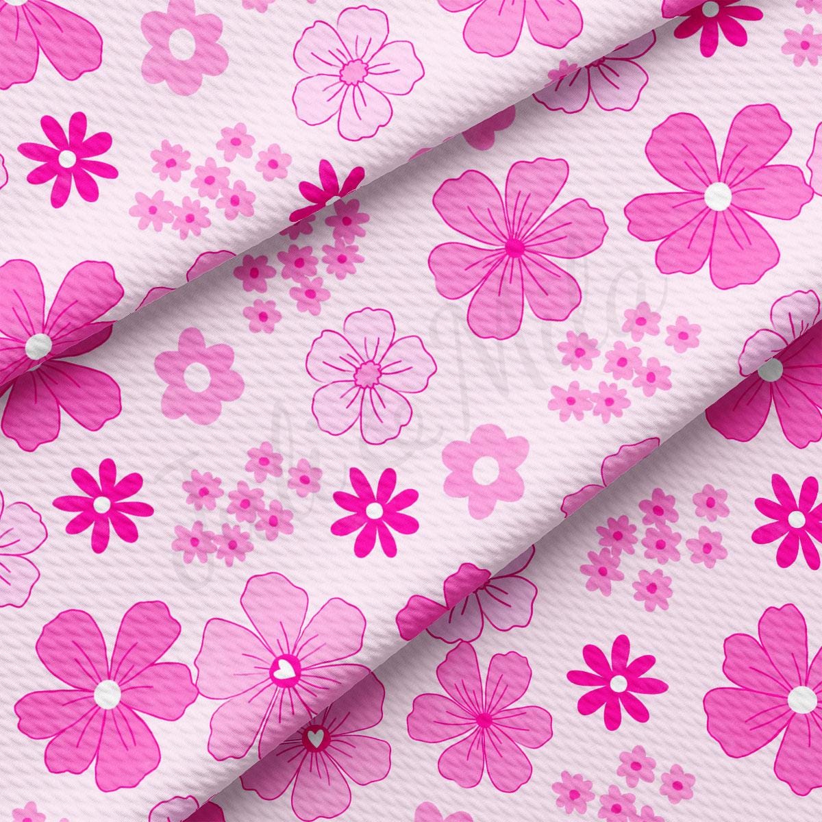 a pink and white flower print fabric