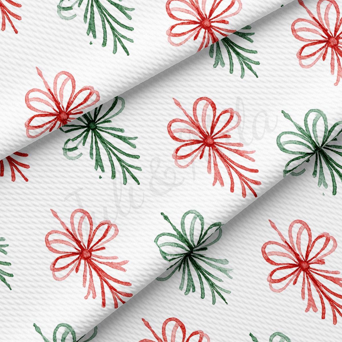 a repeating pattern of red and green bows on a white background.
