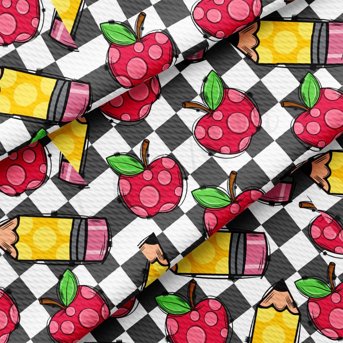 a close up of a pattern with apples on it