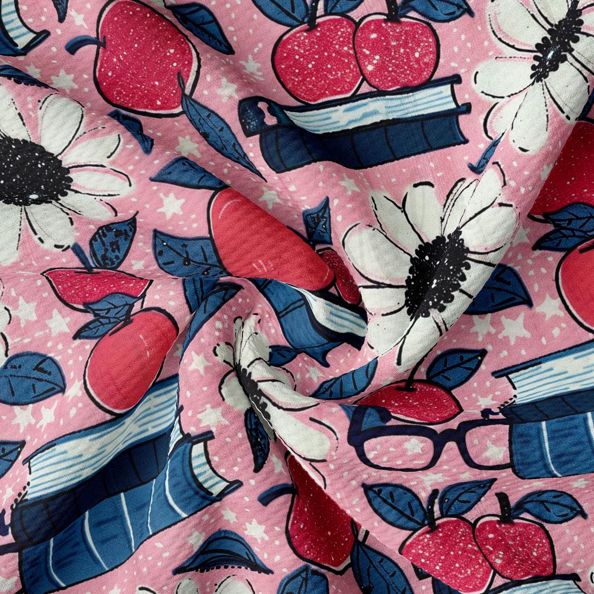 a close up of a pink fabric with flowers and apples on it