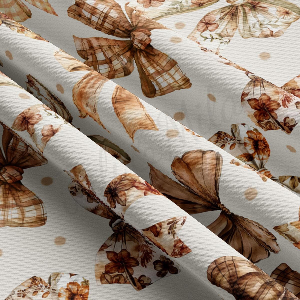 a close-up view of a fabric with a repeating pattern of brown and white floral designs, including flowers and leaves. The fabric appears to be a white material with a textured surface, and the pattern is intricate and detailed.