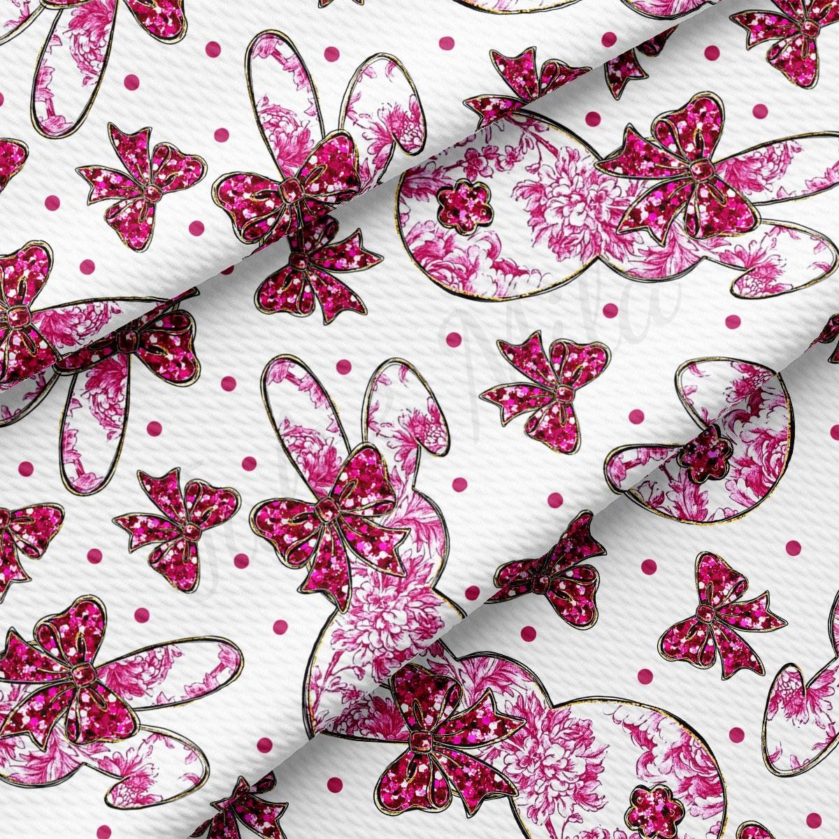 a pink and white fabric with pink flowers on it