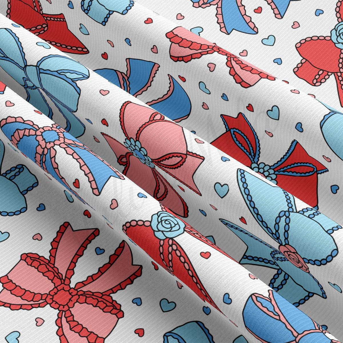 a close up of a pattern of bows and hearts on a white background