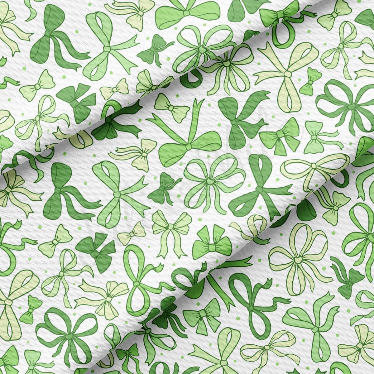 a green and white pattern of shamrocks on a white background