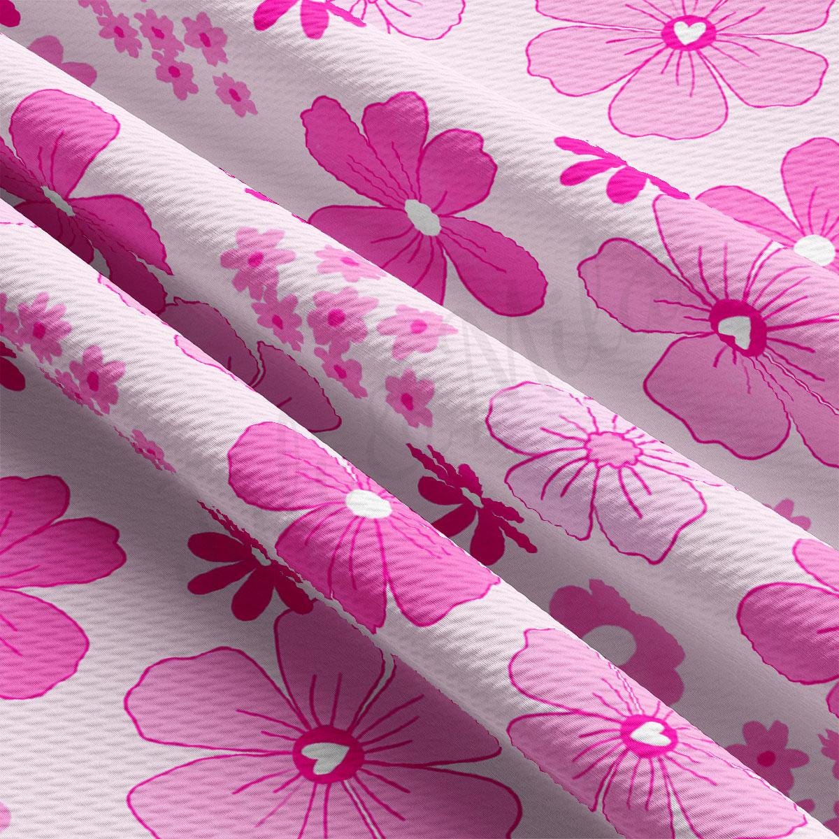 a pink and white flower print fabric