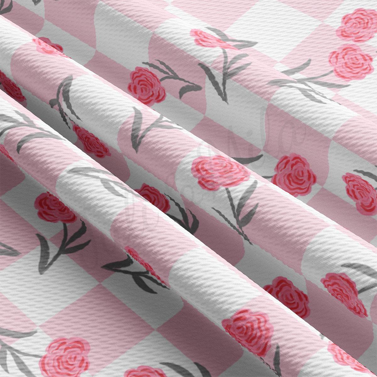 a pink and white wallpaper with roses on it