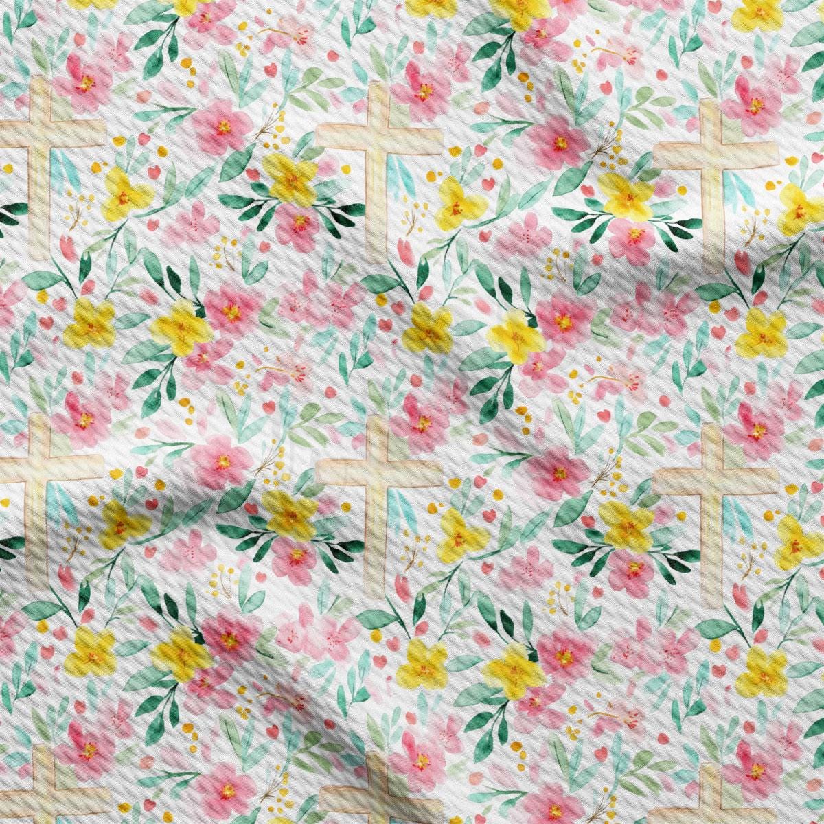 a floral print fabric with yellow, pink, and green flowers