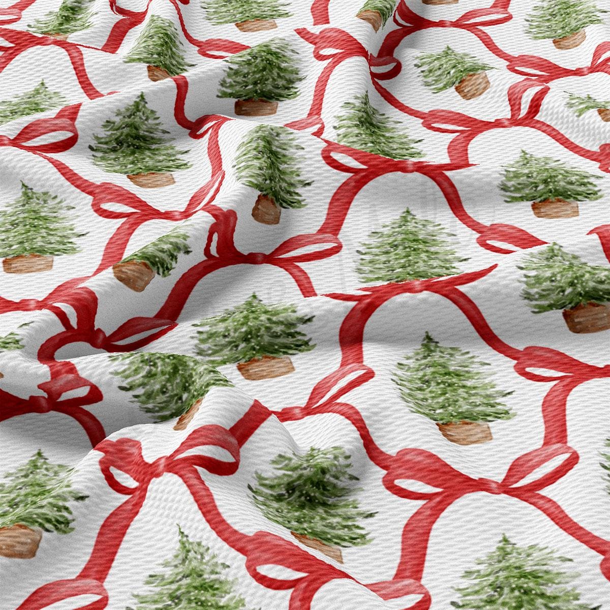 a repeating pattern of Christmas trees with red bows on a white background.