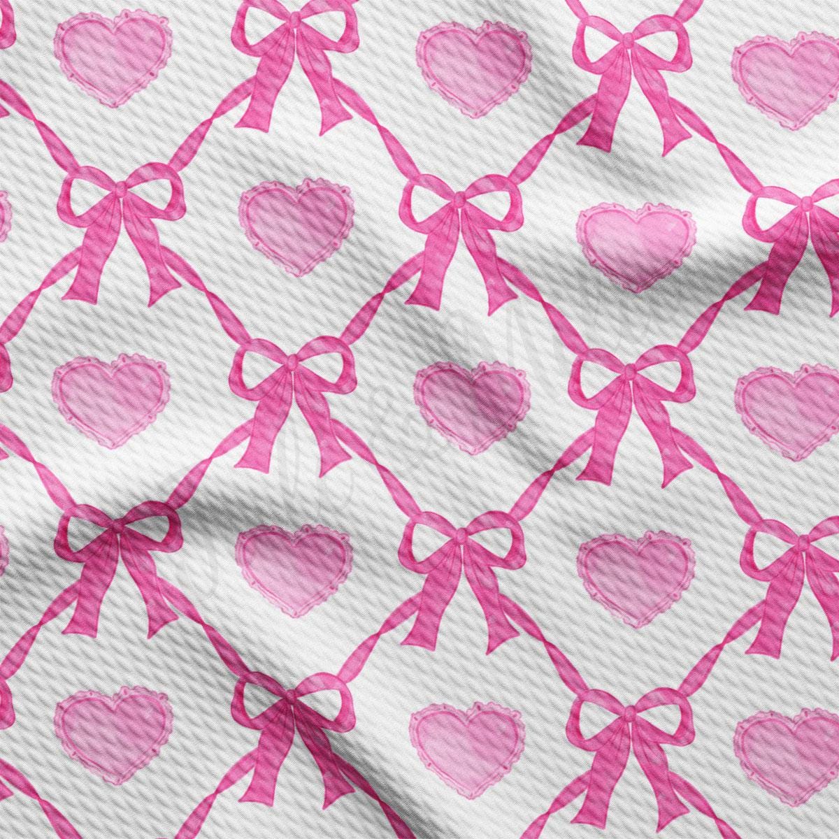 a pink and white background with hearts and bows