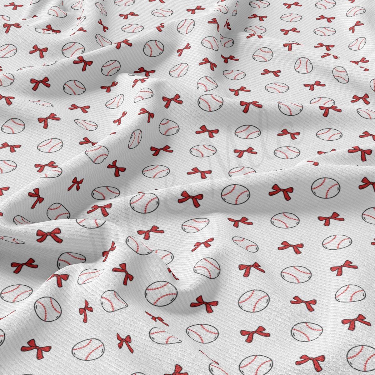 a close up of a baseball pattern on a white fabric