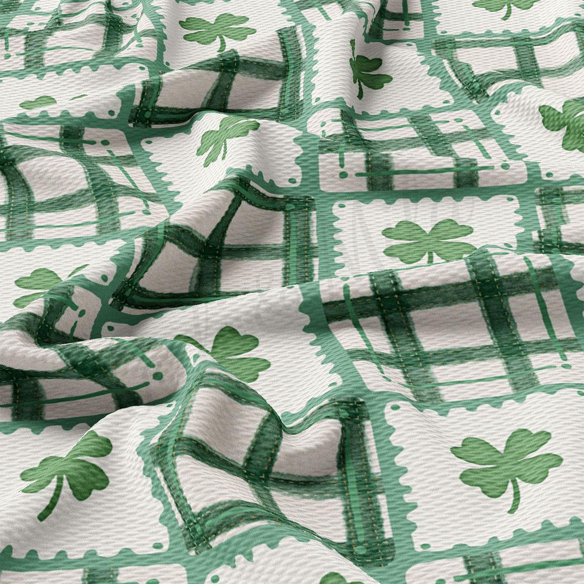 The image is a close-up view of a fabric with a repeating pattern of green shamrocks and green and white checkered designs.