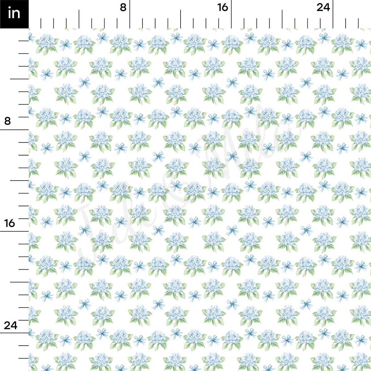 a repeating pattern of blue flowers and green leaves on a white background.