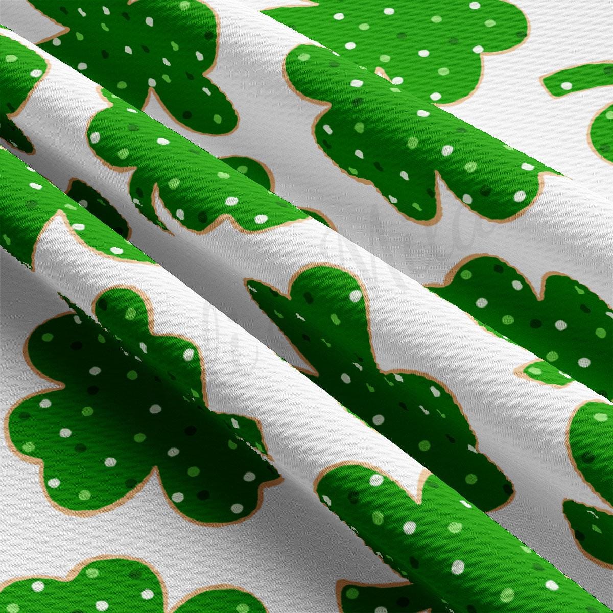 a close up of a green shamrock pattern on a white background