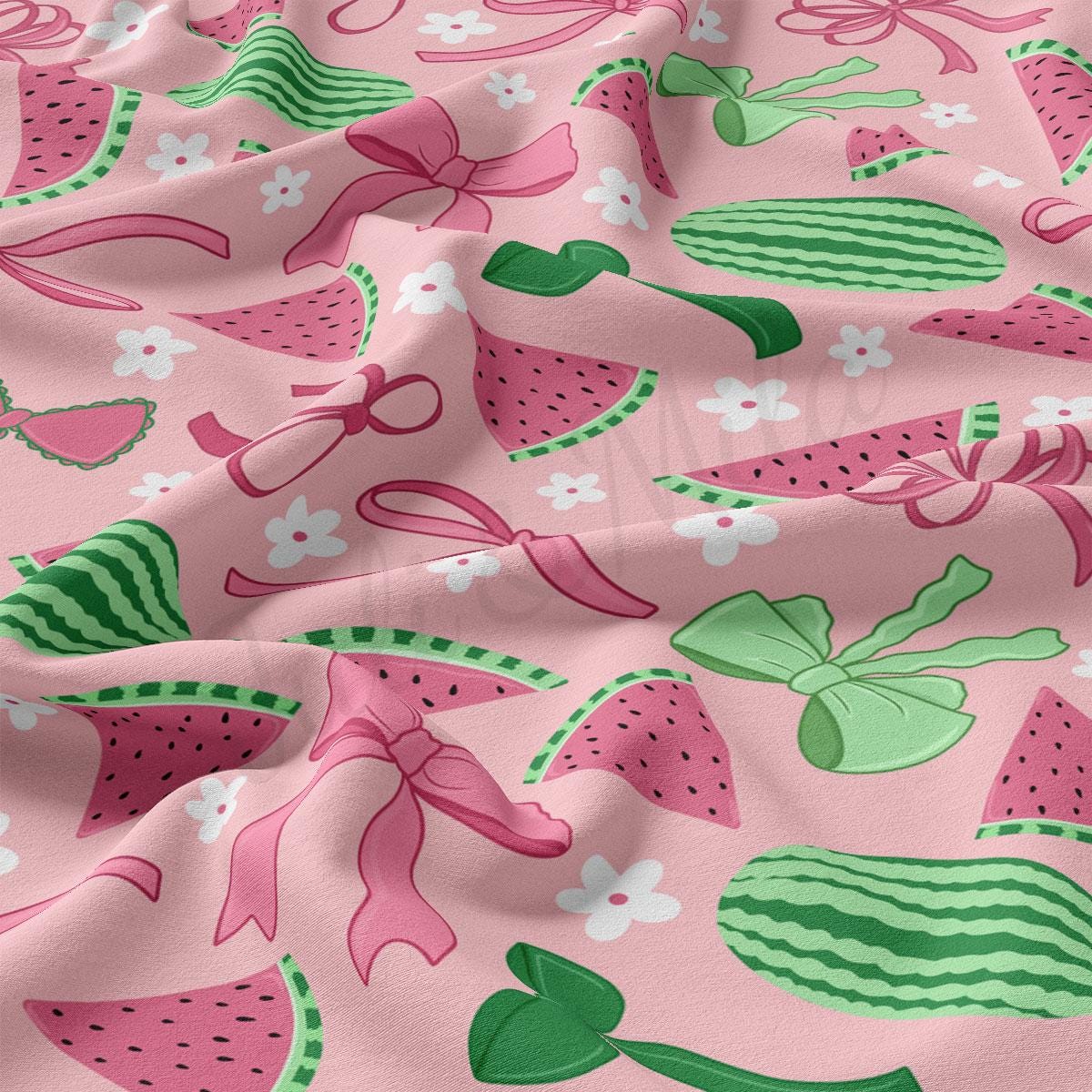 a close up of a pink fabric with watermelon designs