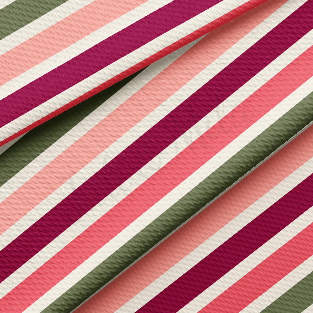 a close up of a pink, green, and red striped material