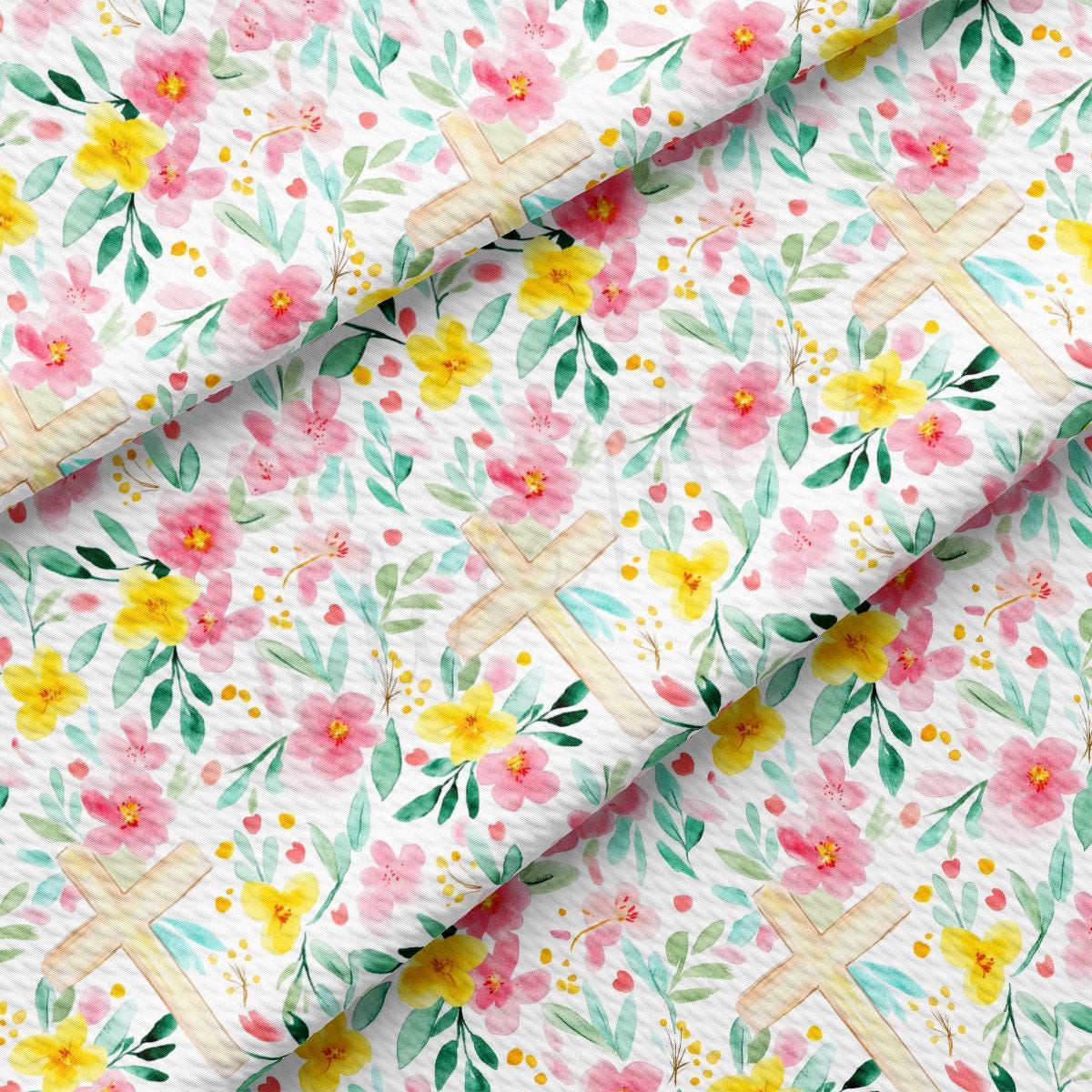 a floral print fabric with pink, yellow and green flowers