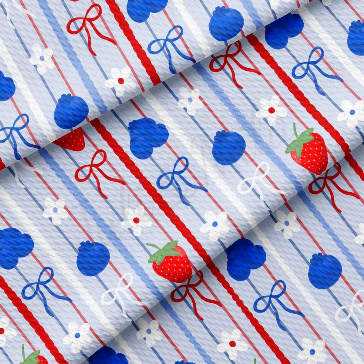 a red, white, and blue striped fabric with a strawberry on it